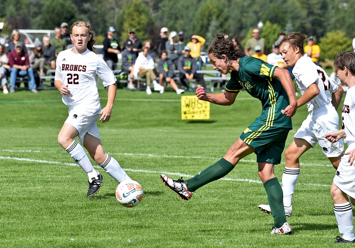 Bulldog Luke Roberts dribbles the ball down the sideline during a game against Frenchtown at Smith Fields in Whitefish on Saturday. (Whitney England/Whitefish Pilot)