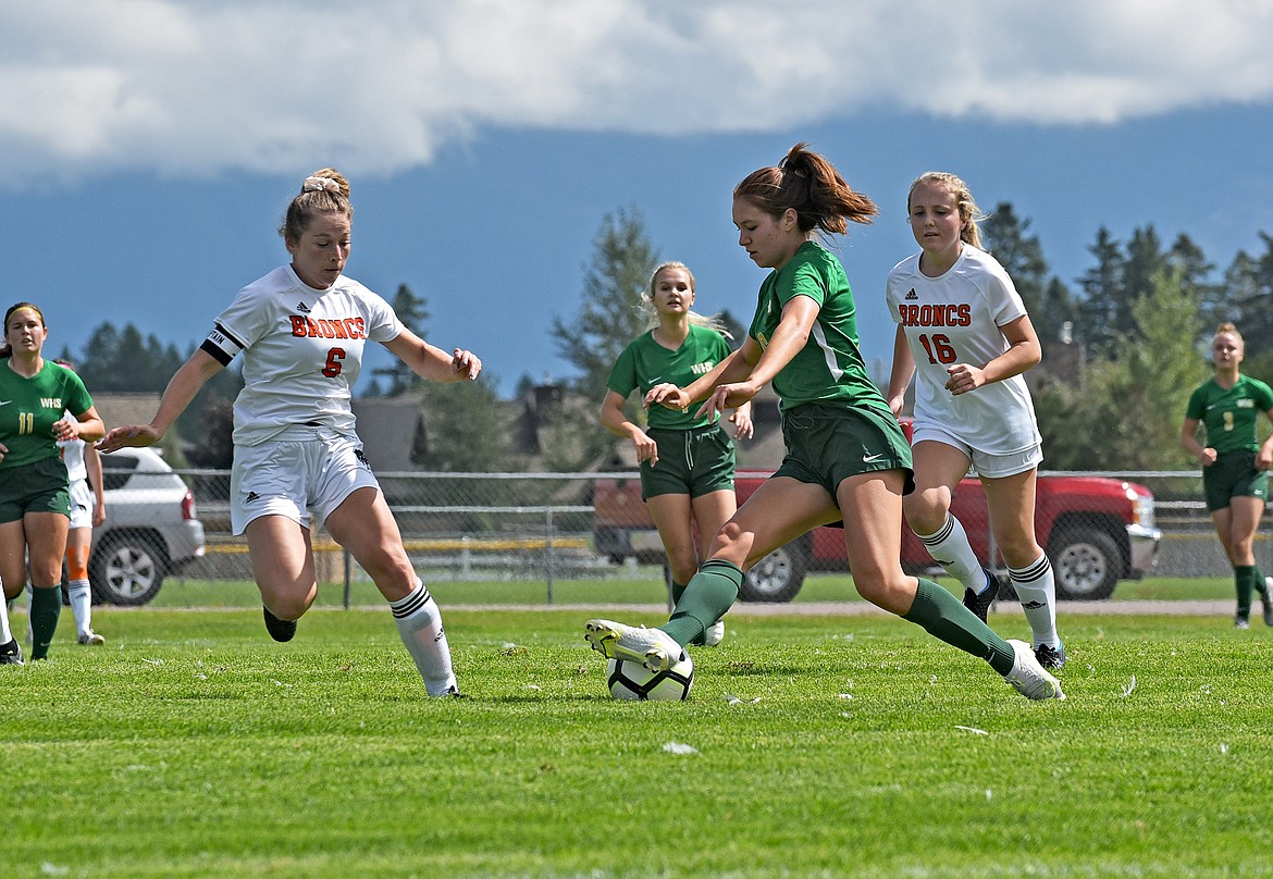 Whitefish senior Adrienne Healy cuts the ball back toward center field in a game against Frenchtown at Smith Fields on Saturday. (Whitney England/Whitefish Pilot)