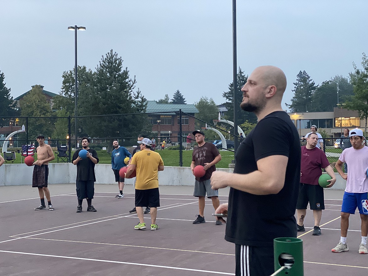 Michael Lenz, right, has offered free pick-up dodgeball at McEuen Park since June but now worries city fees might limit his ability to host the game. (MADISON HARDY/Press)