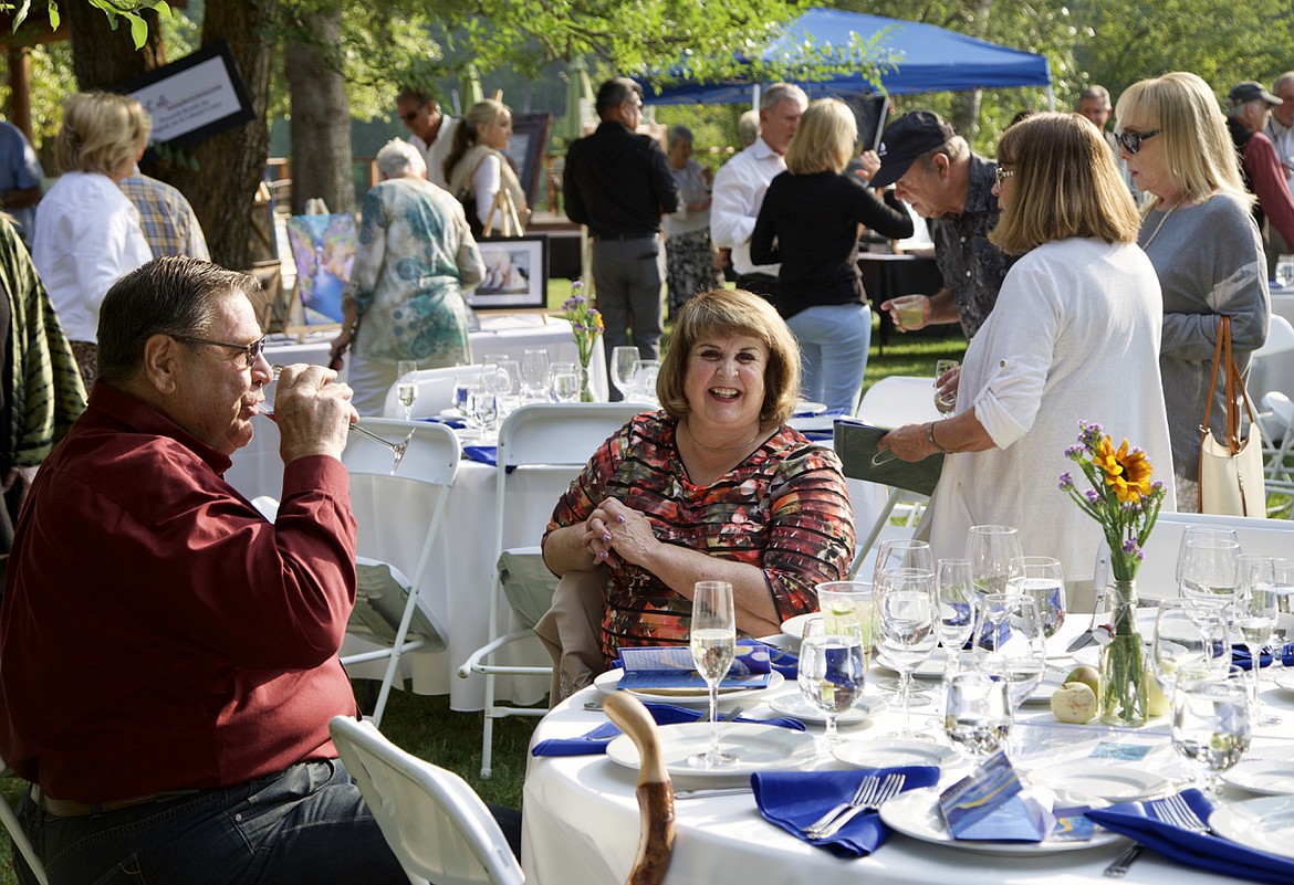 The sun made an appearance at The Art of Summer BACC fundraiser on a pleasant Thursday evening enjoyed by many, including Jerry and Ann Bell. (Kay Bjork photo)