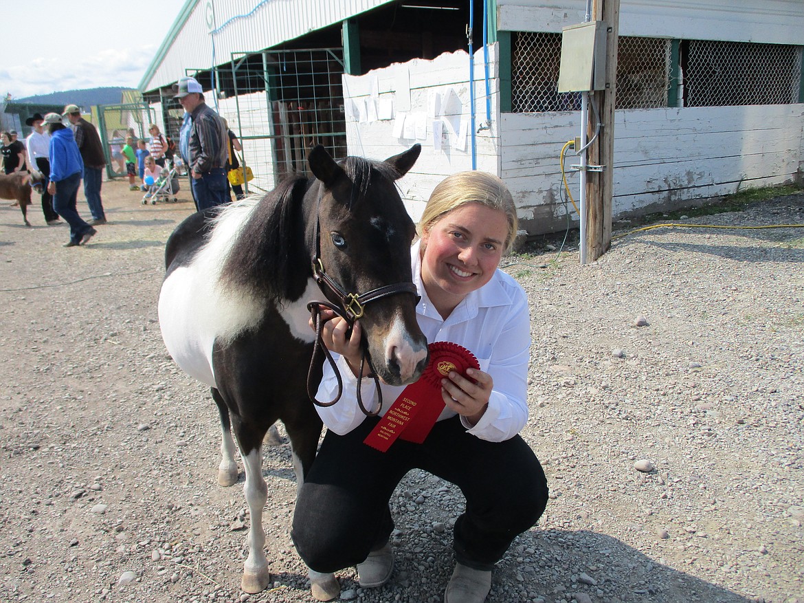 Delcy Stewart with her mini horse Lacey.