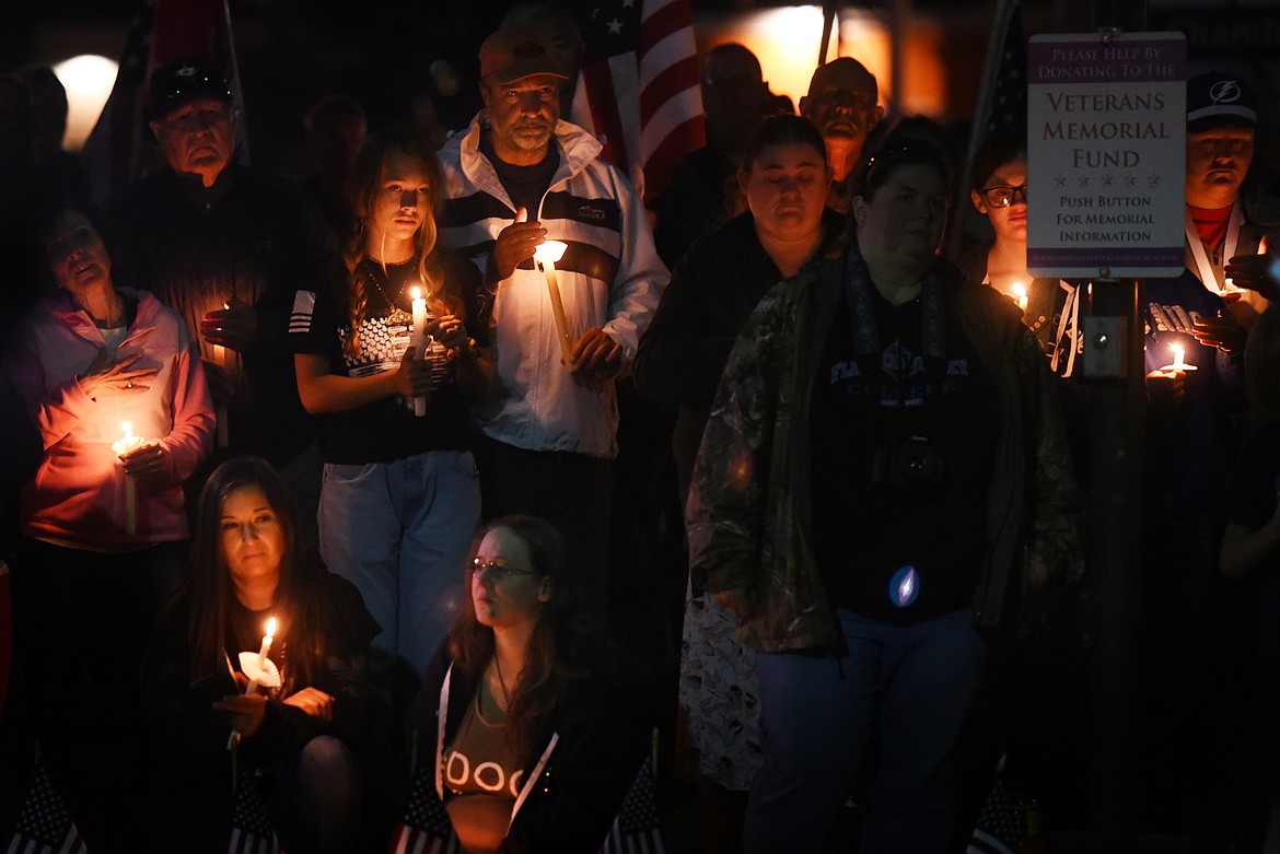 Dozens gathered at the Flathead County Veterans Memorial in Kalispell's Depot Park on Tuesday, Aug. 31, 2021, for a candlelight vigil to honor the 13 U.S. military personnel killed in an Aug. 26 attack outside the Kabul airport in Afghanistan. (Jeremy Weber/Daily Inter Lake)