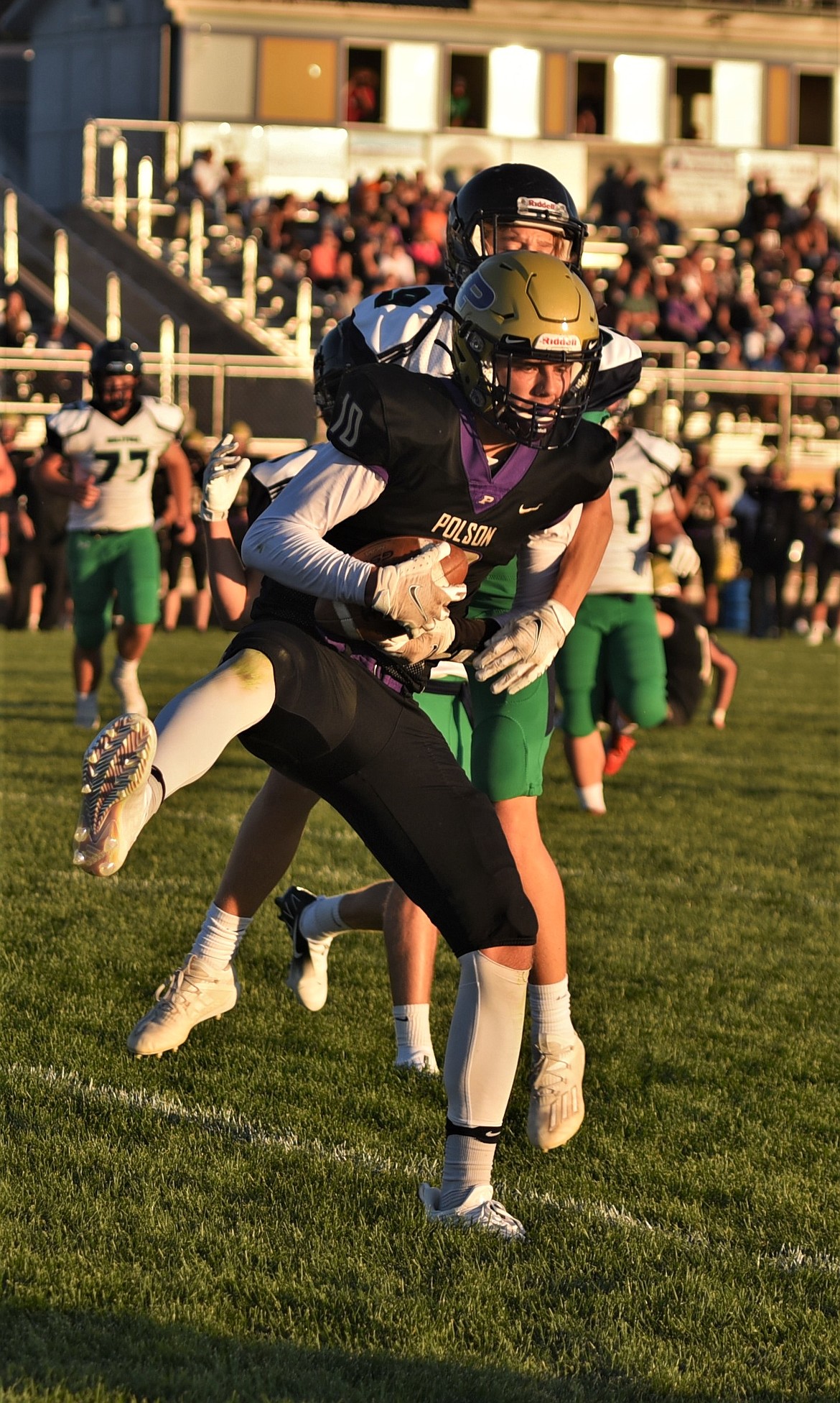 Senior wide receiver Colton Graham catches a touchdown pass from quarterback Jarrett Wilson. (Scot Heisel/Lake County Leader)