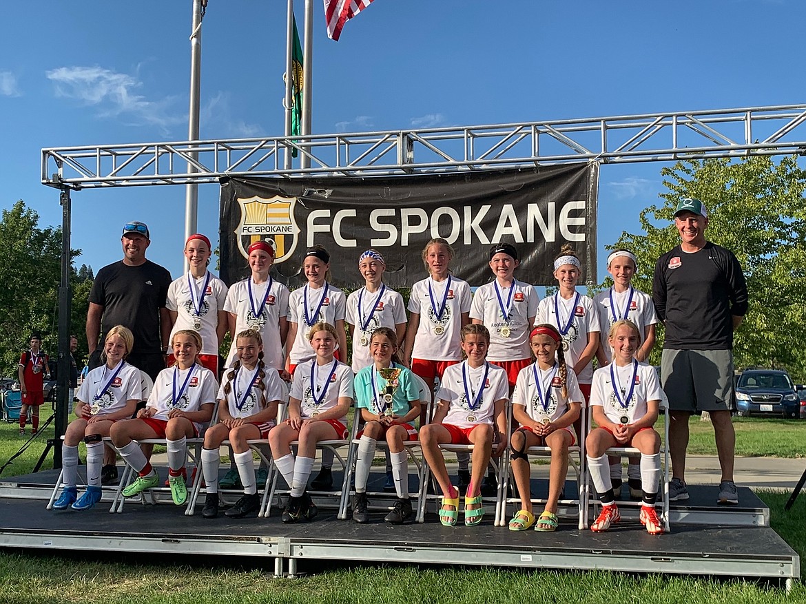 Courtesy photo
The Thorns North Girls 09 Red soccer team won its division at the River City Challenge at Plantes Ferry Park last weekend in Spokane. On Friday the Thorns beat the Eastern Washington Surf 7-0 with Chloe Burkholder scoring 3 goals, Ava Roberts 2, and Katie Kovatch and Sierra Sheppard 1 each. Savannah Spencer had the shutout in goal. On Saturday the Thorns beat the Sandpoint Strikers 4-1. Olivia Smith had a great goal with an assist by Chloe Burkholder, Katie Kovatch had 2 and Ava Roberts finished it off with a goal assisted by Katie Kovatch. Later in the day, the Thorns lost 1-0 to Washington East Escobar on an indirect kick. Sunday in the championship game, the Thorns earned redemption with a 2-0 win over Washington East Escobar on a goal scored by Katie Kovatch and a great PK by Tayla Ruchti. In the front row from left are Lucia Barton, Tayla Ruchti, Audrey Linder, Ryann Blair, Savannah Spencer, Kate Storey, Mallory Morrisroe and Katie Kovatch; and back row from left, coach Dan Linder, Taryn Young, Nell Dodge-Hutchins, Chloe Burkholder, Olivia Smith, Ava Roberts, Phinalley Voigt, Aspen Liddiard, Sierra Sheppard and coach Ty Kovatch.