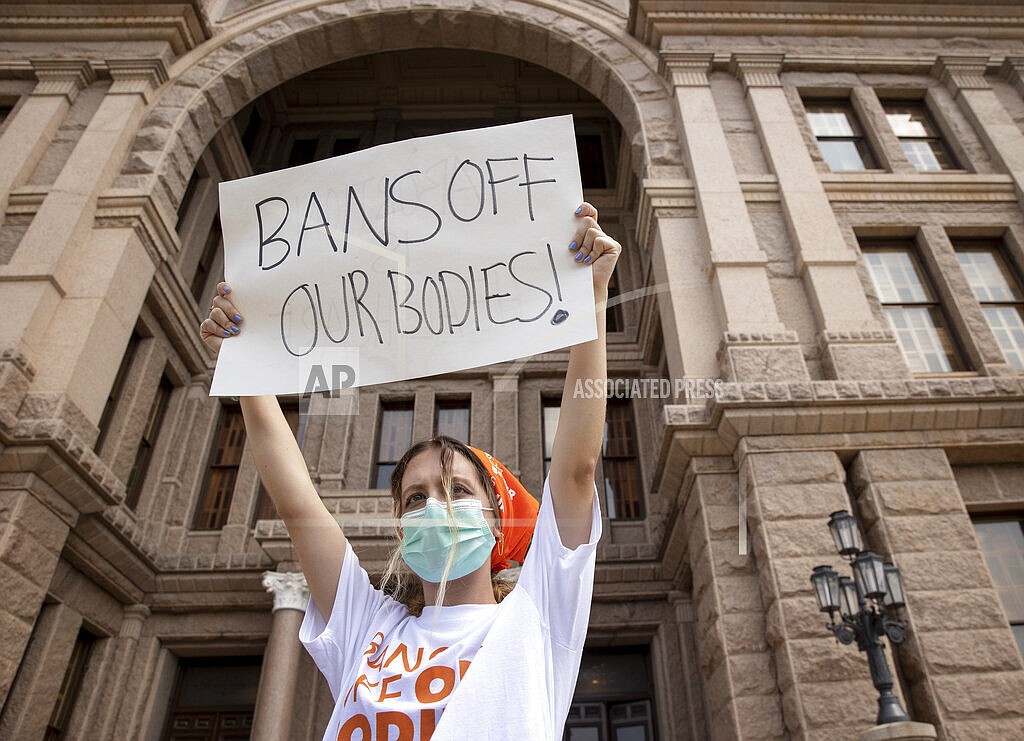 Jillian Dworin participates in a protest against the six-week abortion ban at the Capitol in Austin, Texas, on Wednesday, Sept. 1, 2021. Dozens of people protested the abortion restriction law that went into effect Wednesday. (Jay Janner/Austin American-Statesman via AP)