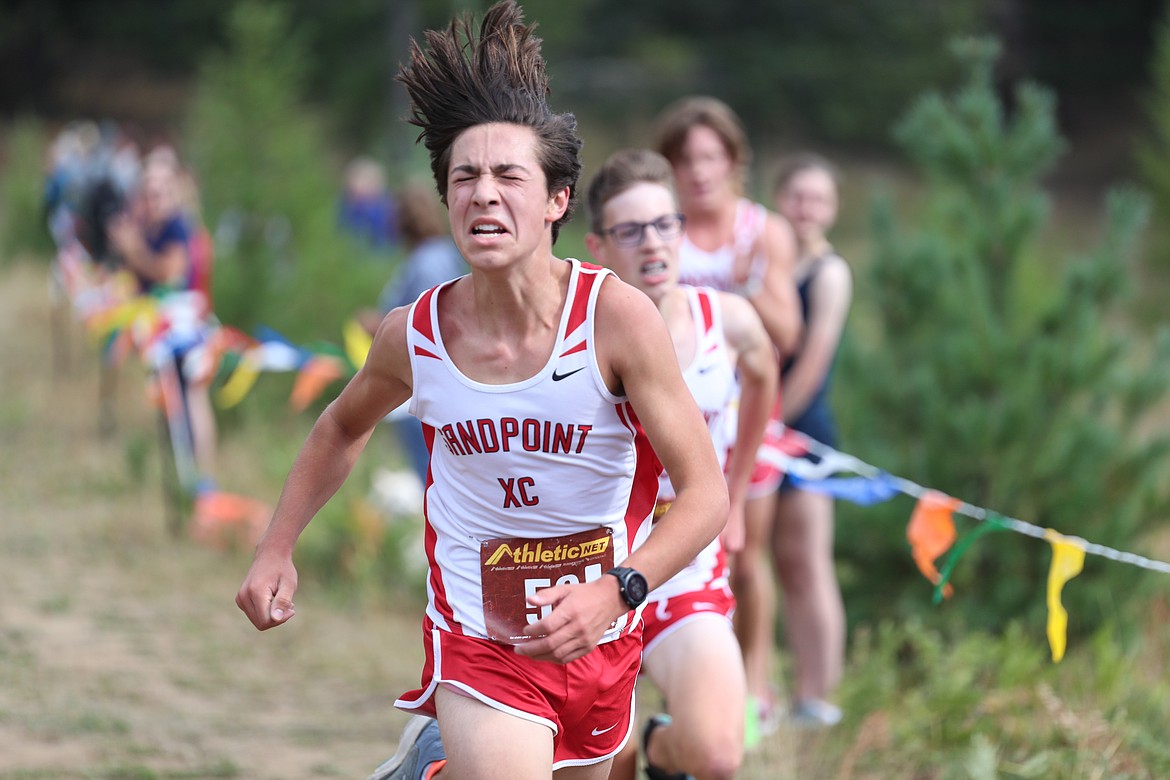 Klein Fragoso grits it out as he crosses the finish line.