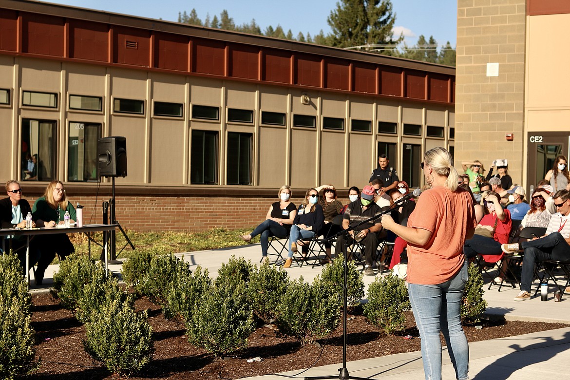 Melanie Swagerty, a parent from Coeur d'Alene, addresses the Board of Trustees and school staff at the community forum for the Coeur d'Alene School District on Thursday at the Lakes Middle School courtyard. HANNAH NEFF/Press