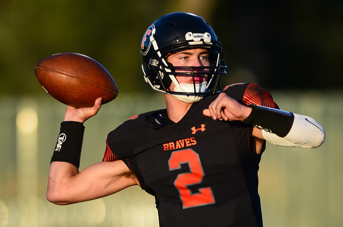 Flathead quarterback Jackson Walker (2) looks to pass in the second quarter against Gallatin at Legends Stadium on Friday, Sept. 3. (Casey Kreider/Daily Inter Lake)