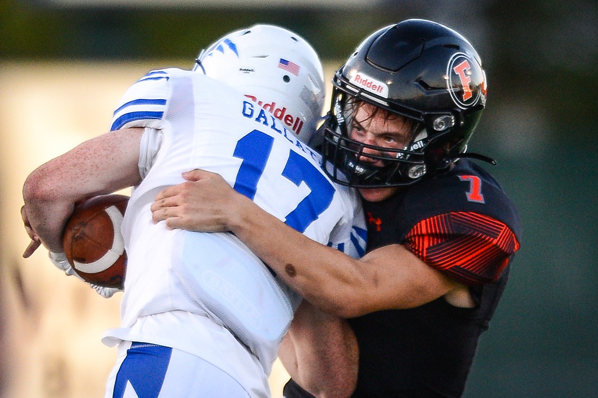 Flathead defensive back Dylan Zink (7) wraps up Gallatin running back Landry Cooley (17) in the second quarter at Legends Stadium on Friday, Sept. 3. (Casey Kreider/Daily Inter Lake)