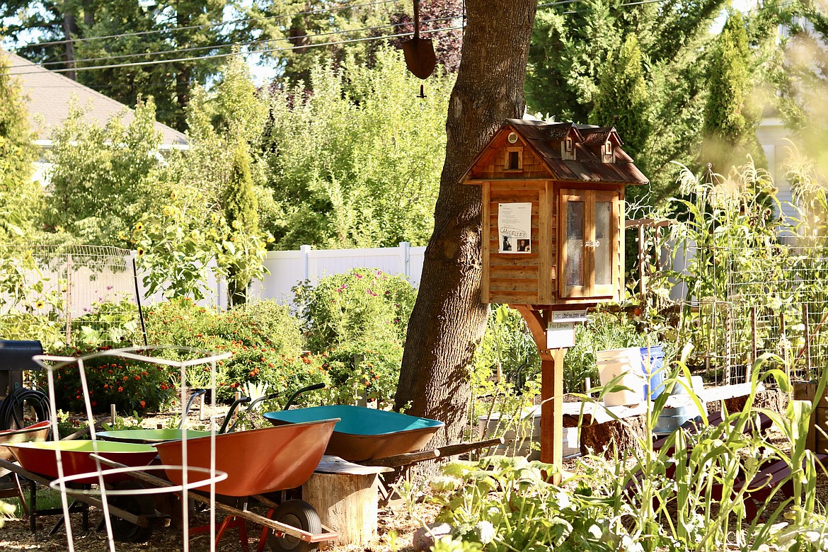 Shared Harvest Community Gardens on 10th Street and Foster Avenue in Coeur d'Alene has a book library for the community in the 60-plot garden. HANNAH NEFF/Press