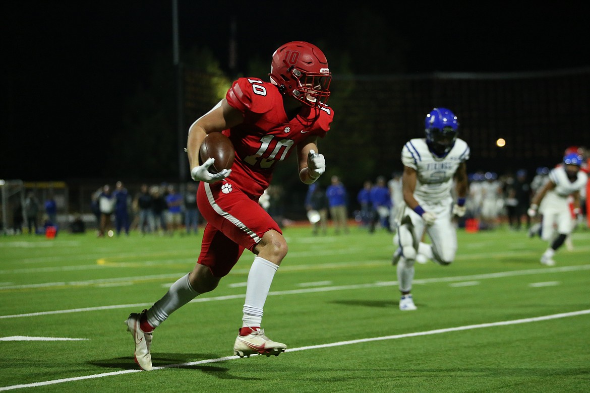 Wide receiver Arie VanDenBerg carries the ball upfield on Friday.