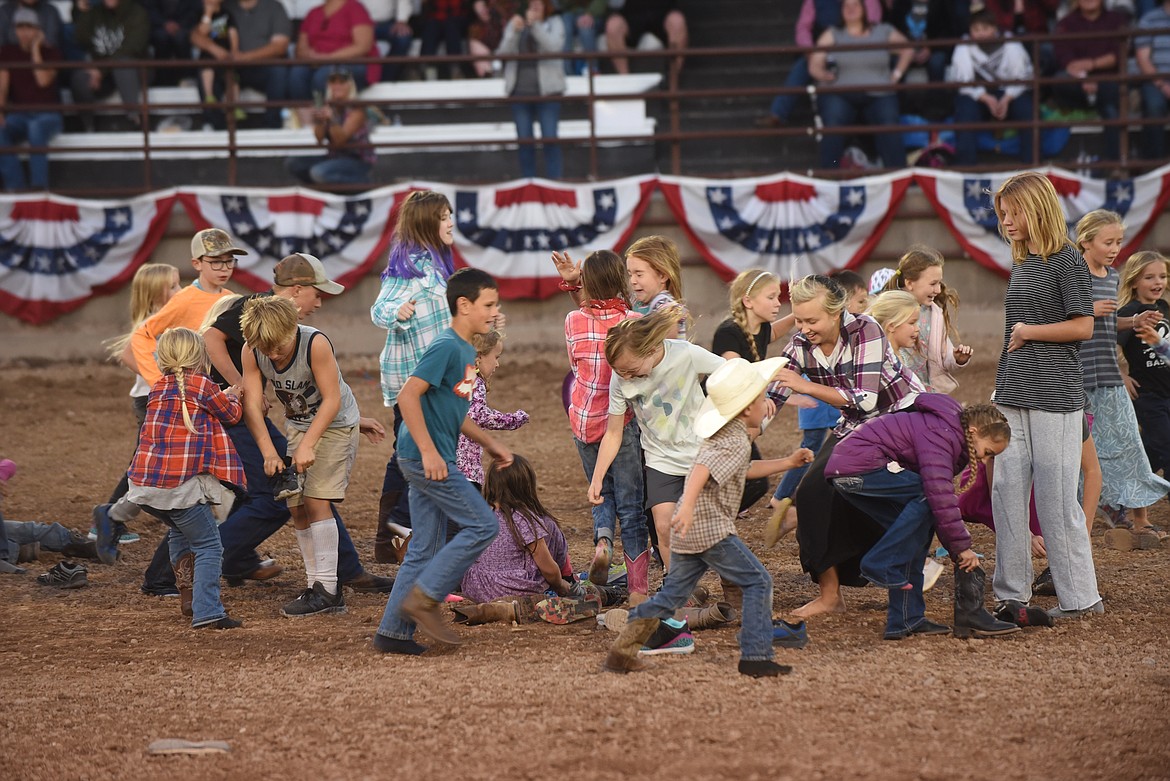 The kids’ boot race was a big hit with competitors and fans Thursday night at the Sanders County Fair. (Scott Shindledecker/Valley Press)