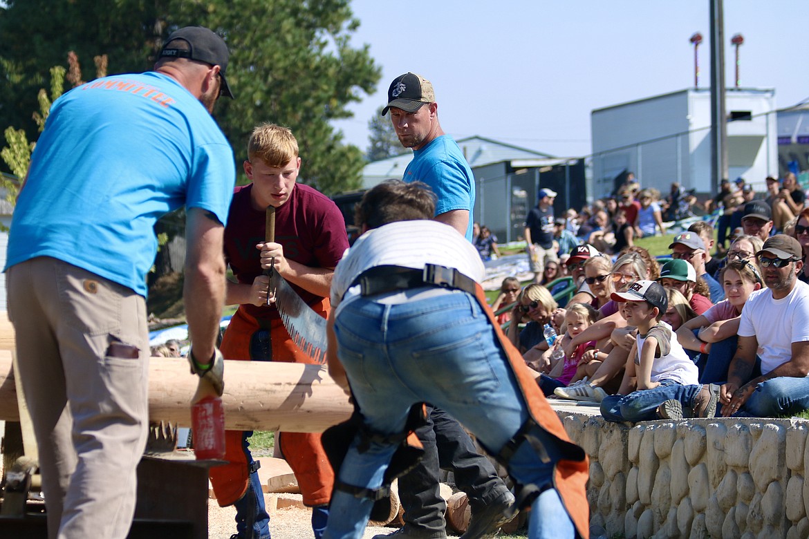 Scott Sotin, 15, of St. Maries competes in the teen cross-cut competition with partner Zander David, 16, or St. Maries at the Paul Bunyan Days logging competition at St. Maries City Park on Sunday. HANNAH NEFF/Press