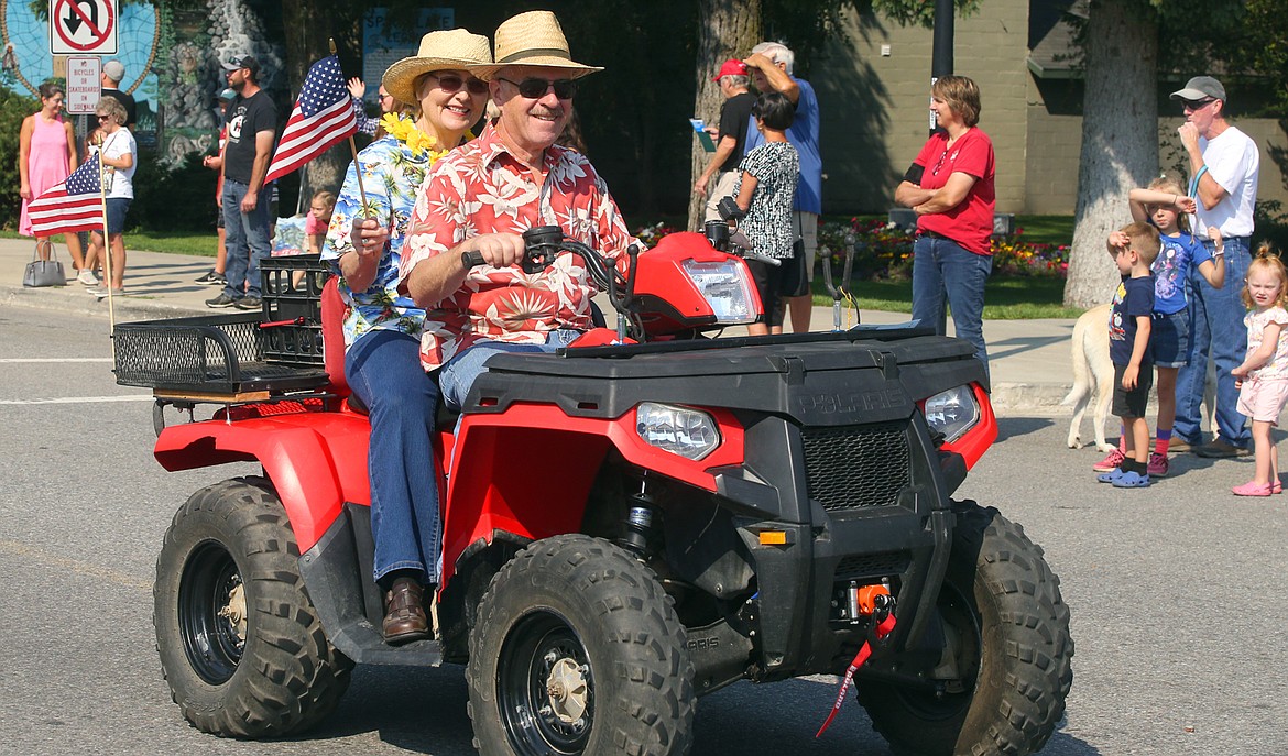 Ed and Paula Hammel of Blanchard wear aloha shirts as they enjoy being in the Spirit Lake Labor Day parade on Sunday.