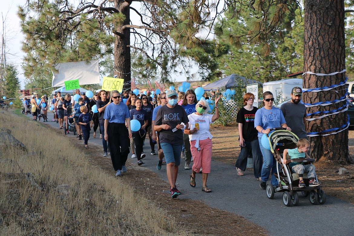 Participants take off from Dog Beach at the start of Sunday's Walk for HOPE walk. The annual event works to raise awareness of suicide and suicide prevention.