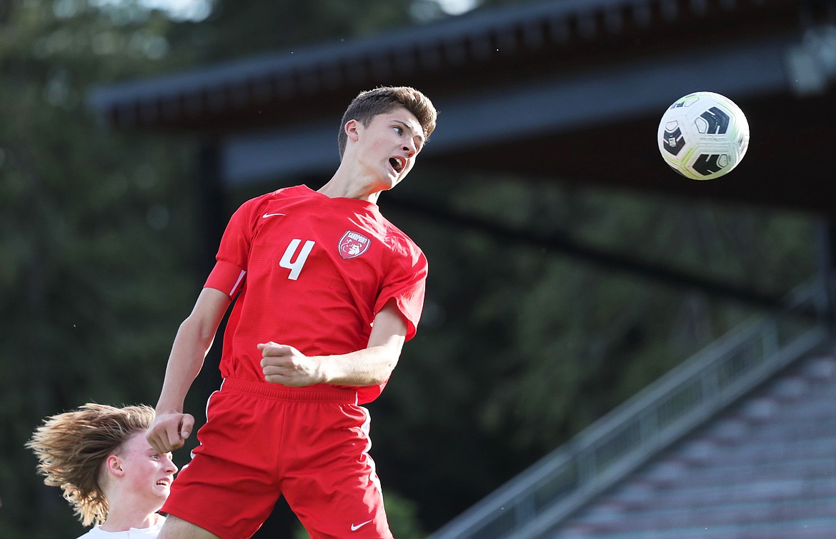 Junior Evan Dickinson heads the ball toward the goal during a game against Moscow on Aug. 31 at War Memorial Field.