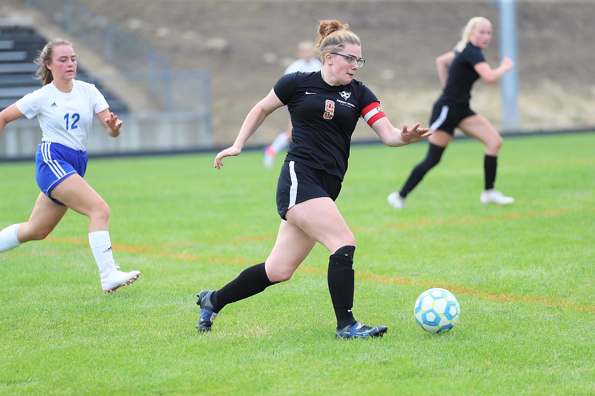 Senior Hannah Wagoner dribbles the ball upfield during a game against Stillwater Christian on Aug. 26.