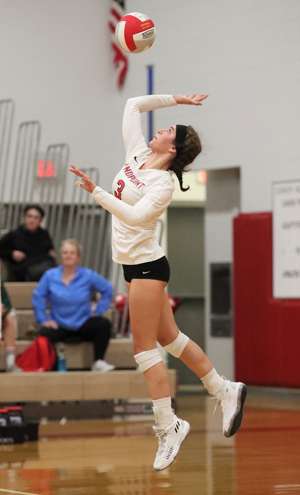 Senior Lauren Breuner jump serves during a match against Timberlake on Aug. 31 at Les Rogers Court.