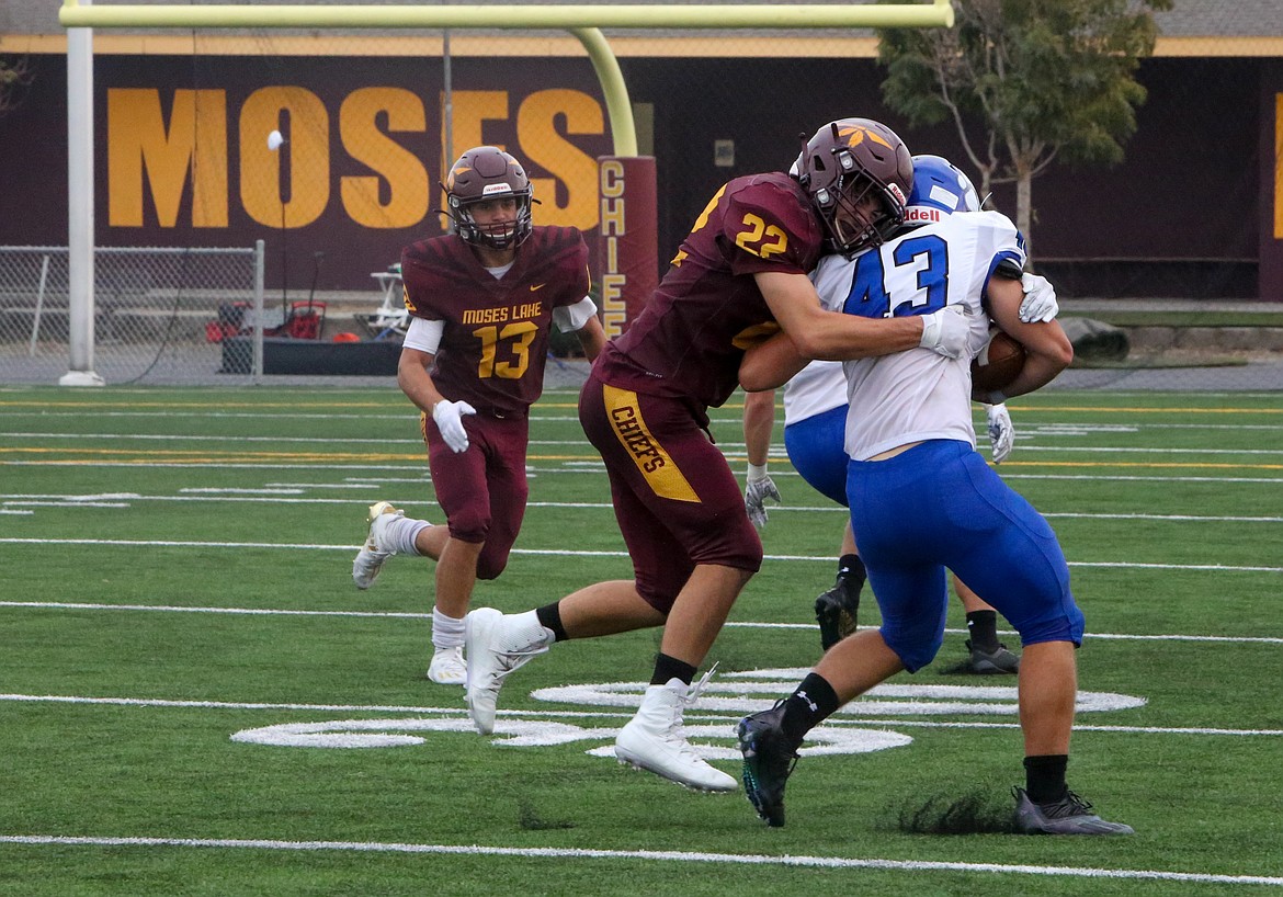 Moses Lake’s Jackson Purcell makes a hit on a Bothell ball carrier in the fourth quarter of Saturday afternoon’s matchup at Lions Field in Moses Lake.