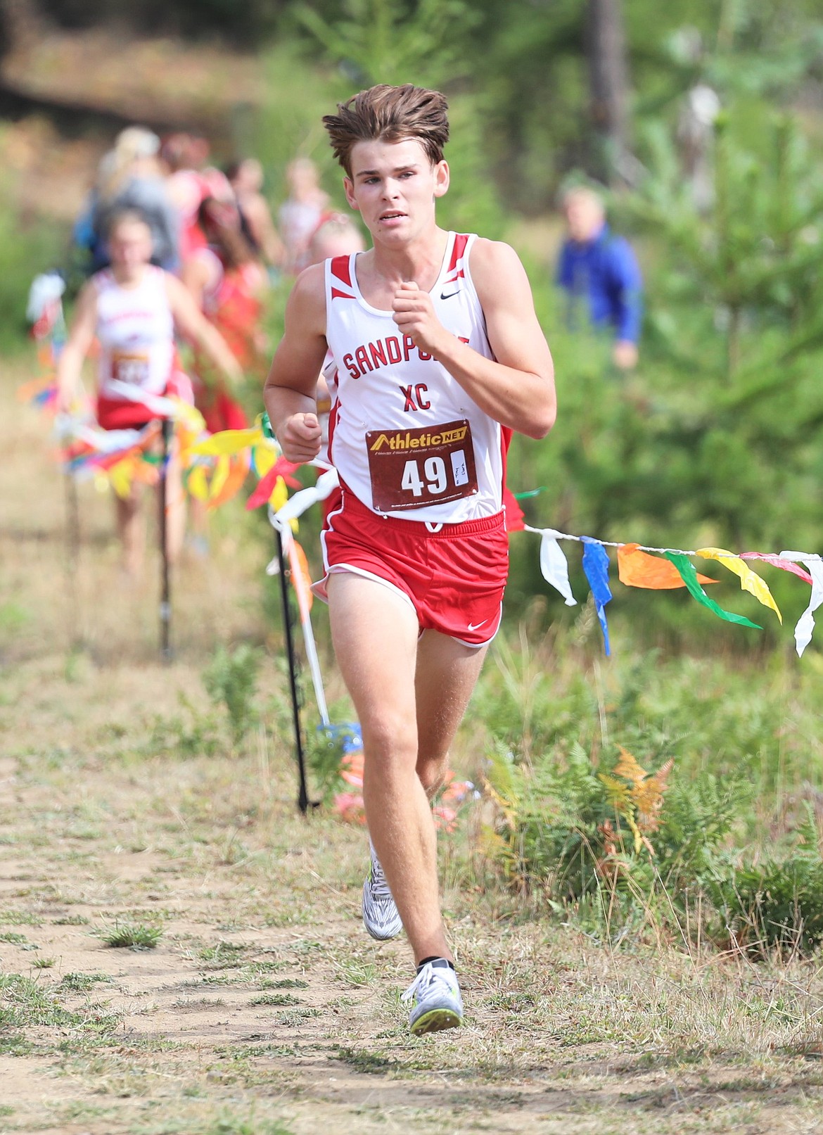 Senior Trey Clark closes in on the finish of the Pine Street Woods Invite on Aug. 27.