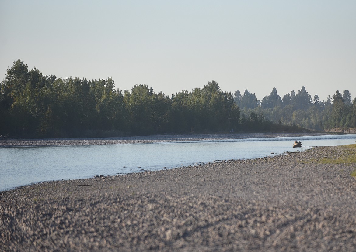 Investigators from the Flathead County Sheriff's Office recovered human remains from the Flathead River below the Montana Fish, Wildlife and Park fishing access site at Pressentine Bar on Monday, Aug. 6, 2021. (Scott Shindledecker/Daily Inter Lake)