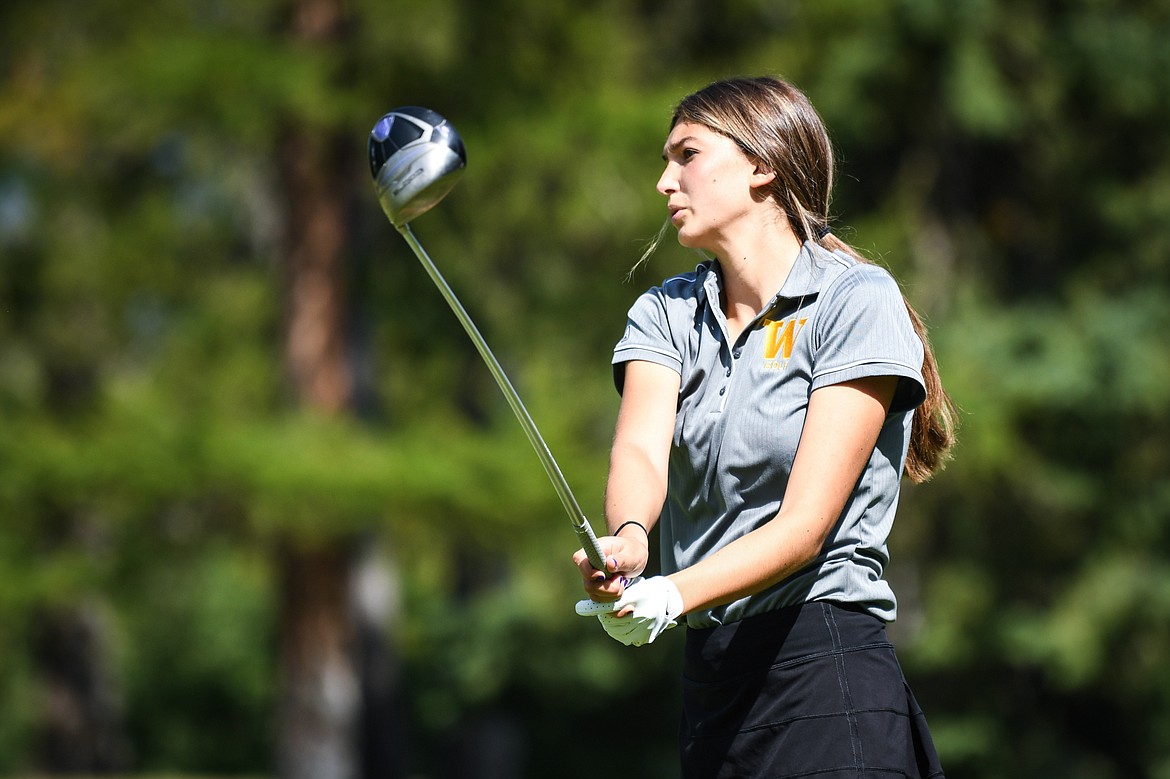 Whitefish's Anyah Cripe watches her tee shot on the fourth hole of the South Course during the Whitefish Triangular at Whitefish Lake Golf Club on Tuesday, Sept. 7. (Casey Kreider/Daily Inter Lake)