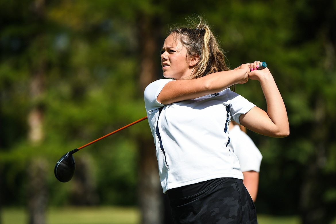 Glacier's Chloe Tanner watches her tee shot on the fourth hole of the South Course during the Whitefish Triangular at Whitefish Lake Golf Club on Tuesday, Sept. 7. (Casey Kreider/Daily Inter Lake)