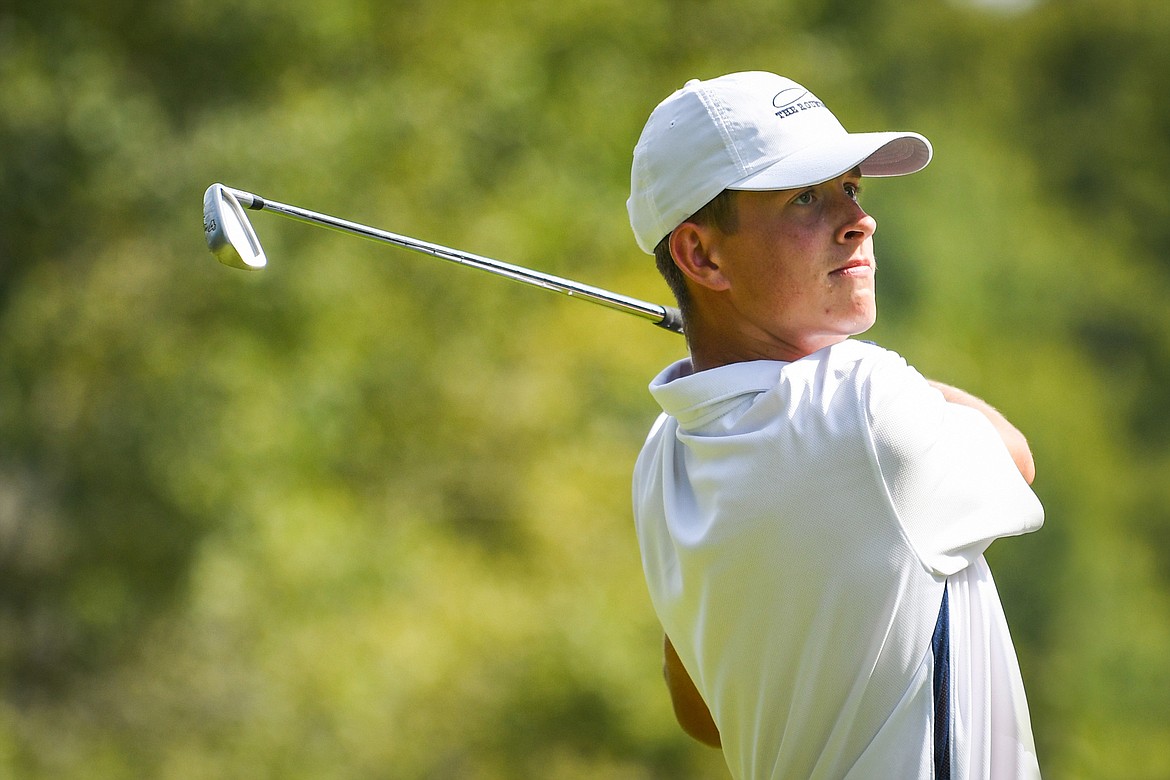 Glacier's Tyler Avery watches his tee shot on the fifth hole of the South Course during the Whitefish Triangular at Whitefish Lake Golf Club on Tuesday, Sept. 7. (Casey Kreider/Daily Inter Lake)