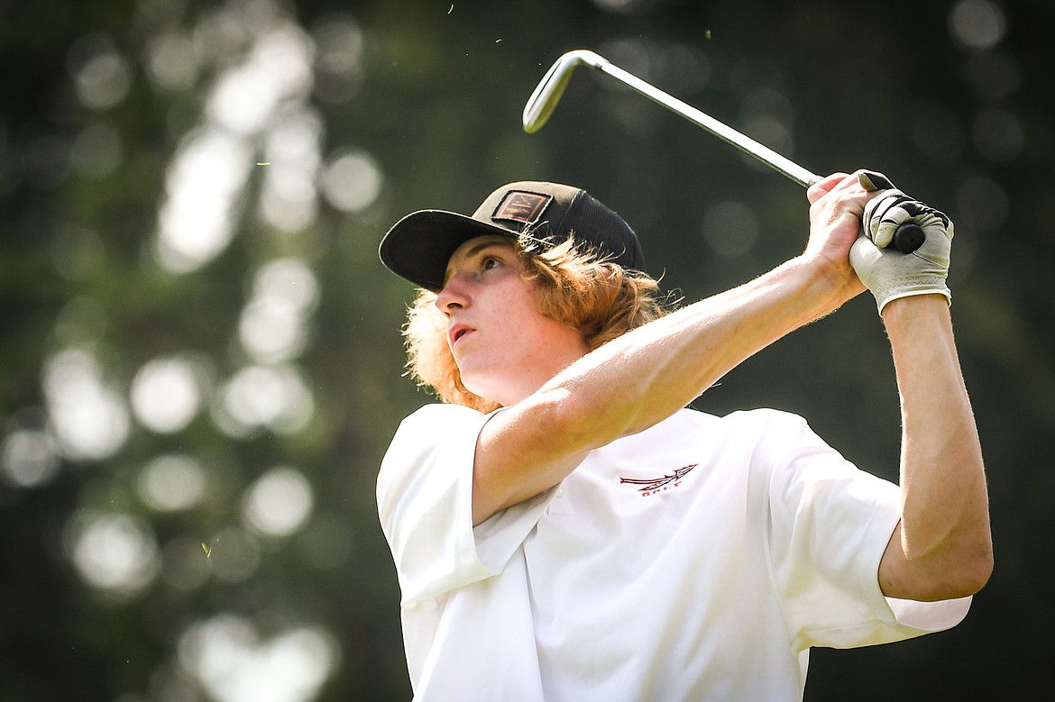 Flathead's Joston Cripe watches his tee shot on the third hole of the South Course during the Whitefish Triangular at Whitefish Lake Golf Club on Tuesday, Sept. 7. (Casey Kreider/Daily Inter Lake)