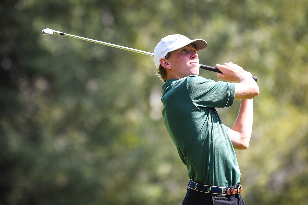 Whitefish's Billy Smith watches his tee shot on the fifth hole of the South Course during the Whitefish Triangular at Whitefish Lake Golf Club on Tuesday, Sept. 7. (Casey Kreider/Daily Inter Lake)