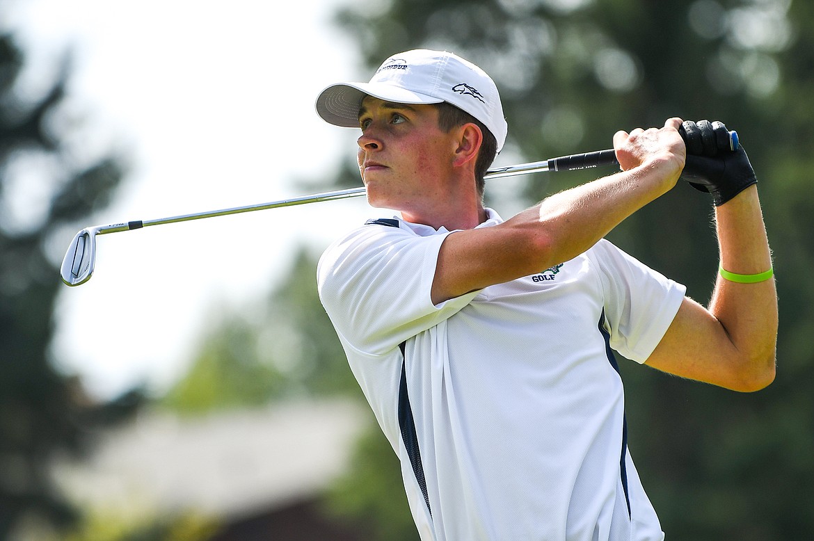 Glacier's Tyler Avery watches his tee shot on the third hole of the South Course during the Whitefish Triangular at Whitefish Lake Golf Club on Tuesday, Sept. 7. (Casey Kreider/Daily Inter Lake)