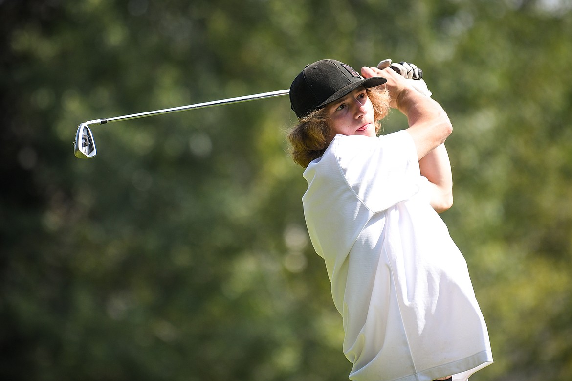 Flathead's Joston Cripe watches his tee shot on the fifth hole of the South Course during the Whitefish Triangular at Whitefish Lake Golf Club on Tuesday, Sept. 7. (Casey Kreider/Daily Inter Lake)