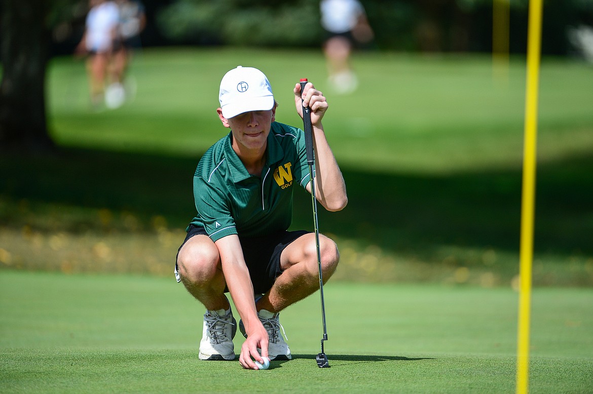 Whitefish's Billy Smith lines up a putt on the second hole of the South Course during the Whitefish Triangular at Whitefish Lake Golf Club on Tuesday, Sept. 7. (Casey Kreider/Daily Inter Lake)