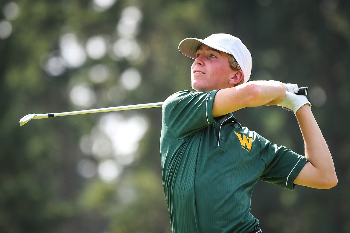 Whitefish's Billy Smith watches his tee shot on the third hole of the South Course during the Whitefish Triangular at Whitefish Lake Golf Club on Tuesday, Sept. 7. (Casey Kreider/Daily Inter Lake)