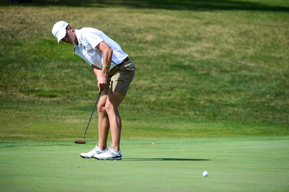 Glacier's Tyler Avery putts on the second hole of the South Course during the Whitefish Triangular at Whitefish Lake Golf Club on Tuesday, Sept. 7. (Casey Kreider/Daily Inter Lake)