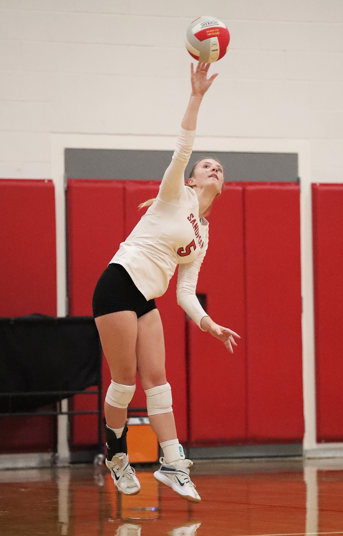 Audrey Sheffler serves during Tuesday's match.