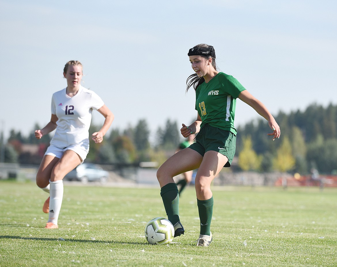 Bulldog Maya Lacey protects the ball last week against Polson at Smith Fields. (Whitney England/Whitefish Pilot)