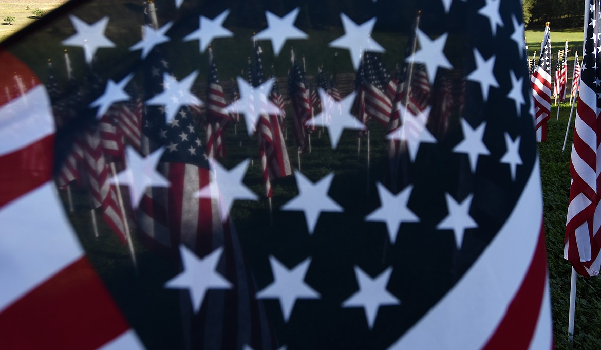 With 300 American flags on display just north of Bigfork off Highway 35, the 9/11 Honor and Serve Foundation is partnering with the Field of Honor Rally Project to help raise funds for Heroes and Horses and The Paladin Conservancy. (Jeremy Weber/Daily Inter Lake)