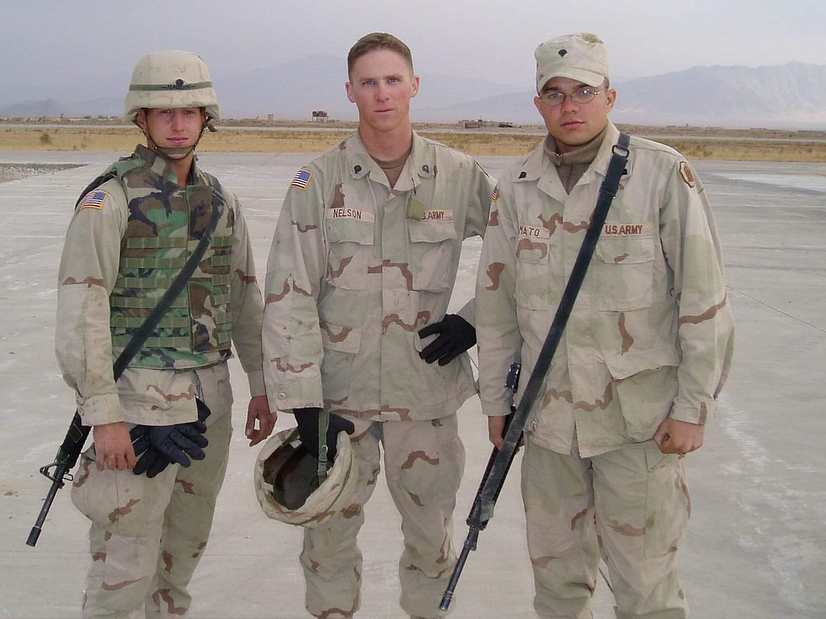 Jesse Nelson (middle) during his time serving with the US Army National Guard in Afghanistan. (photo provided)