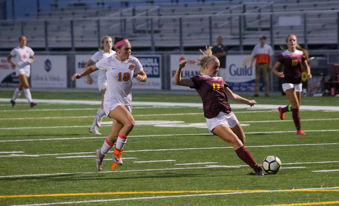 Moses Lake’s Bailey Richie, 13, fires in a shot against Lewis & Clark High School in the first half to put the Chiefs in front 3-1 on Tuesday night at Lions Field.