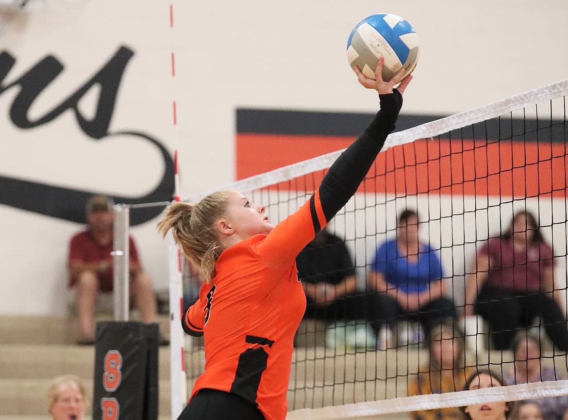 Priest River's Allyson Barton tips the ball over the net during Thursday's match against Clark Fork.