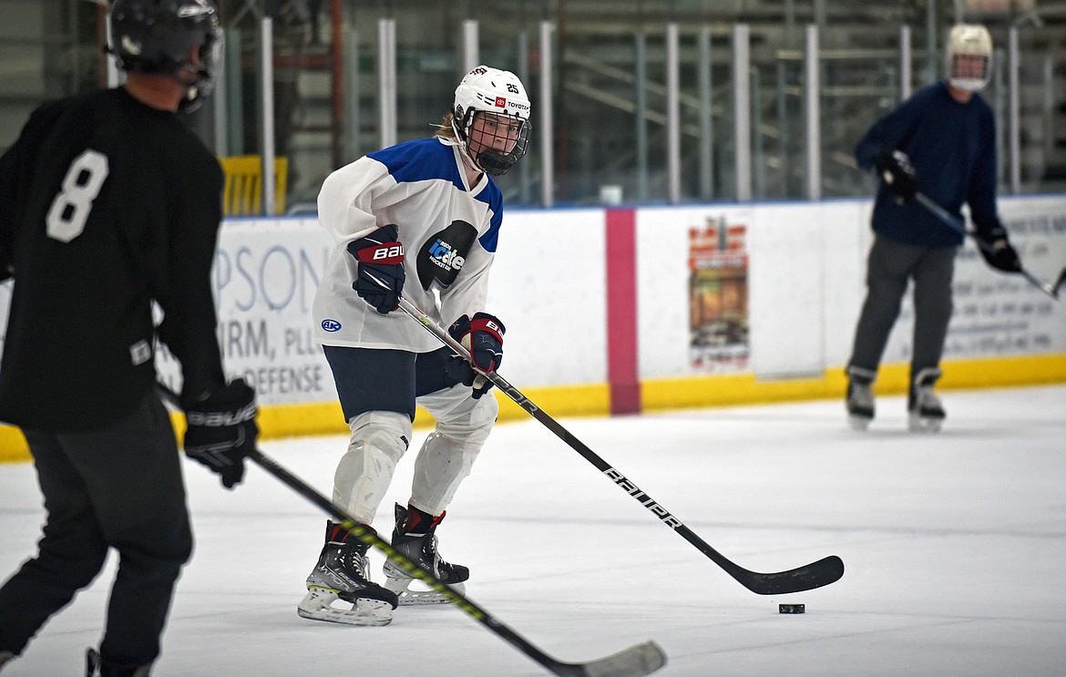 Finley McCarthy plays hockey at a recent drop-in session at the Stumptown Ice Den in Whitefish. (Whitney England/Whitefish Pilot)