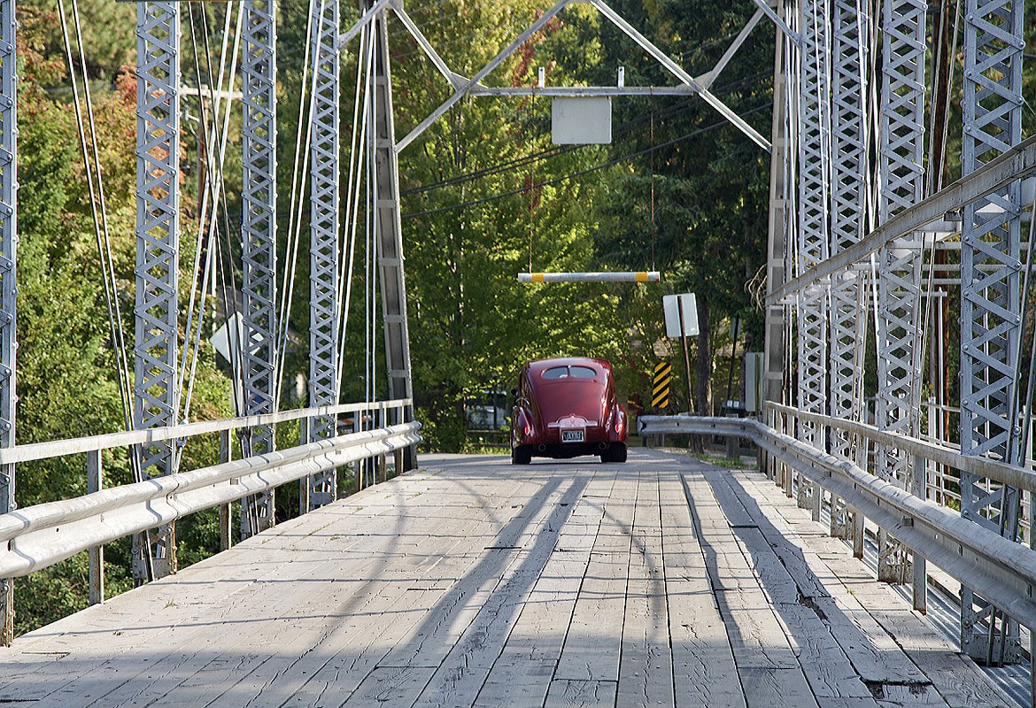 A vintage car crosses the one-lane bridge on the way to the Rumble in the Bay car show. (Kay Bjork photo)