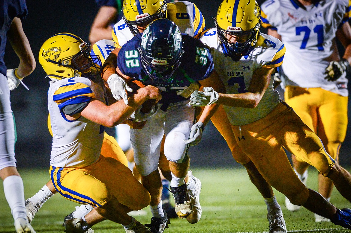 Glacier wide receiver Jake Turner (32) fights for extra yardage on a third quarter reception against MIssoula Big Sky at Legends Stadium on Friday, Sept. 10. (Casey Kreider/Daily Inter Lake)