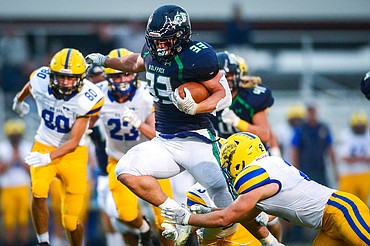 Glacier running back Jake Rendina (33) picks up yardage on a first-quarter run against Missoula Big Sky at Legends Stadium on Friday, Sept. 10. (Casey Kreider/Daily Inter Lake)