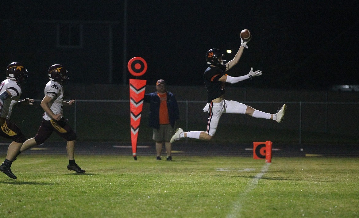 MARK NELKE/Press
Carson Tucker (18) of Post Falls scores on a 17-yard run in the fourth quarter Friday night against Moses Lake.