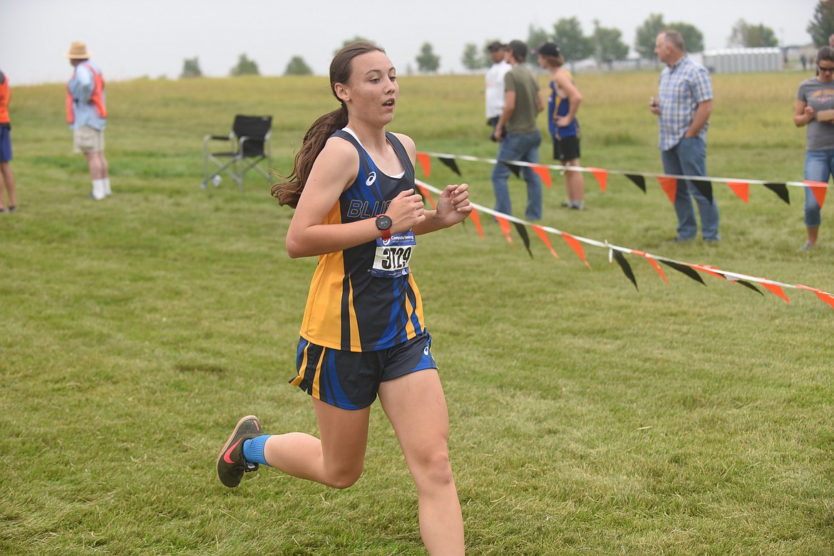 Thompson Falls' Hattie Neesvig heads to the finish line at last Friday's Flathead Invite in Kalispell. Neesvig placed 18th. (Scott Shindledecker/Valley Press)