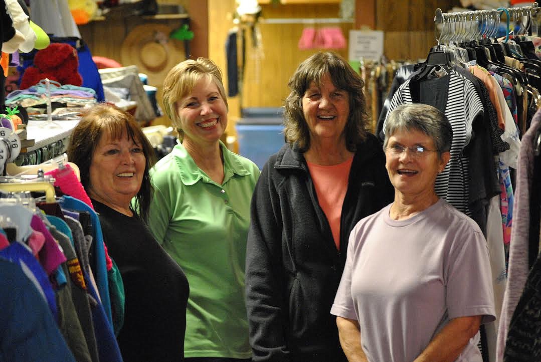 From left, are Kat Thompson, Suzie Robinson, Norma Cyr and Kathryn Verley, as they pause for a moment in their busy day at the Women in Timber Thrift store in Superior. Since reopening nearly a month ago, on Tuesdays and Wednesdays they've been jam packed with processing new donations and handling a huge influx in customers the ladies don't have much time to rest. (Amy Quinlivan/Mineral Independent)