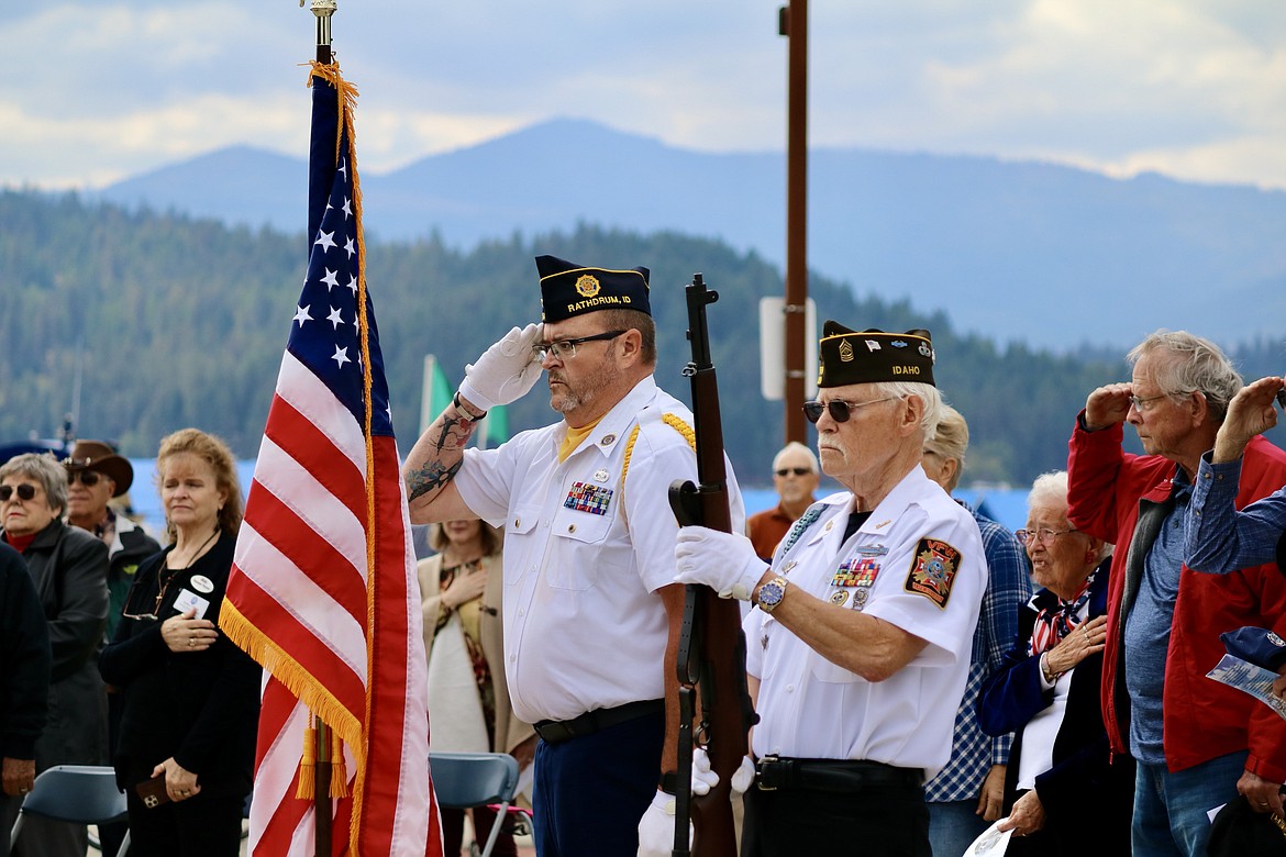 From left, Jeff Broadhead, Master Sergeant, and Bob Martin, First Sergeant perform Honor Guard at the ceremony to commemorate the 100th anniversary of The Tomb of the Unknown Soldier with a special plaque and rose garden at the Veterans Memorial in McEuen Park in downtown Coeur d’Alene on Saturday. HANNAH NEFF/Press
