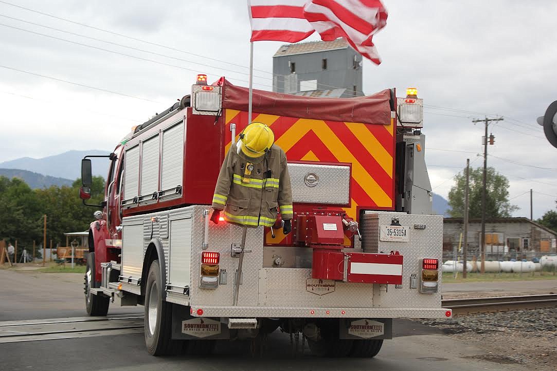 Plains-Paradise Rural Fire Department members and trucks participated in a parade last Saturday to honor first responders who perished in the Sept. 11, 2001, terrorist attacks on the United States. (Monte Turner/Valley Press)